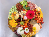 Gourmet charcuterie board with artisanal cheeses, cured meats, fruits, and nuts